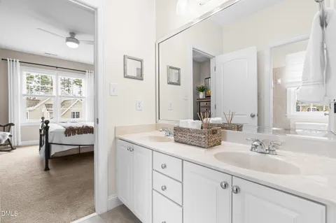 a bathroom with a toilet and a shower curtain