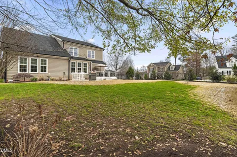 a view of yard with swimming pool and trees