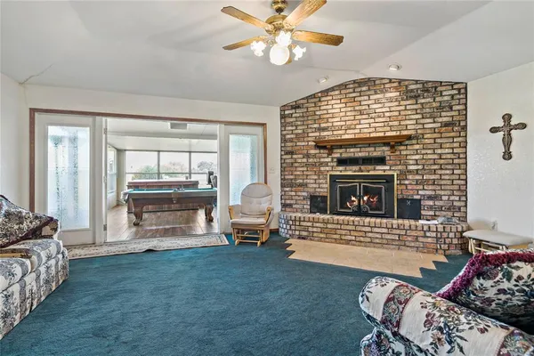 a view of a dining room with furniture and window