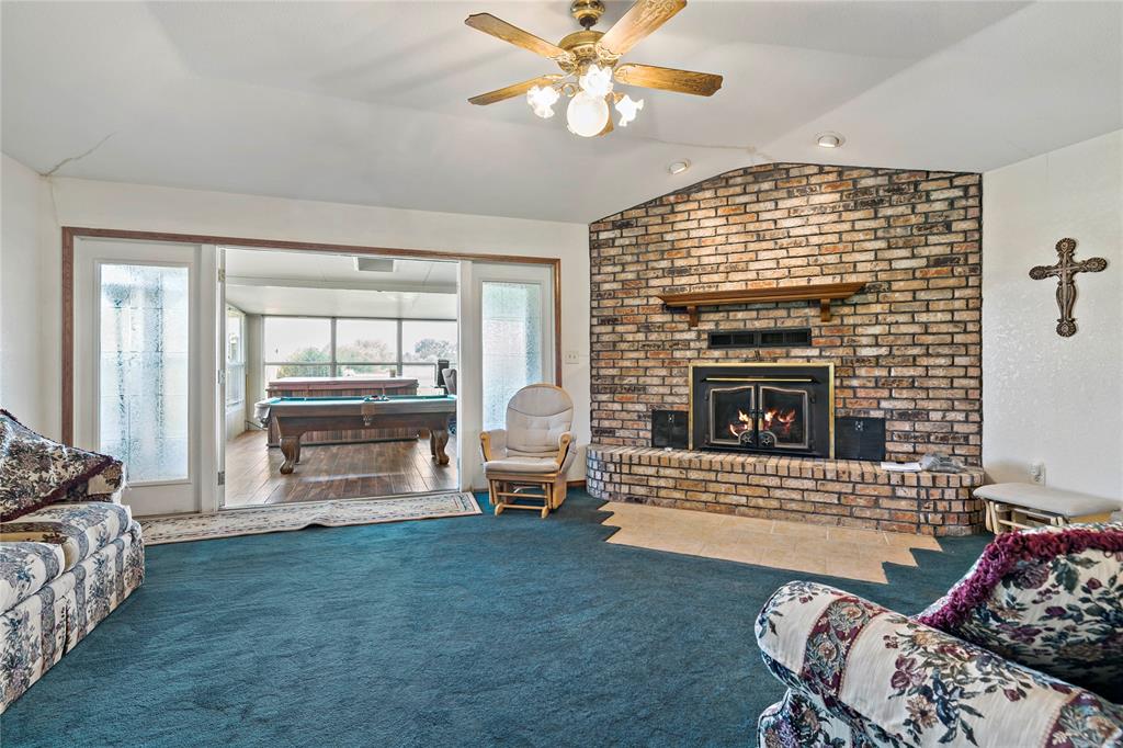 4395 Farm Road 2820 Brookston, TX 75421 - Photo 13 of 33 a living room with furniture and a fireplace
