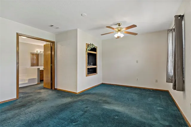 a bathroom with a tub a sink and a mirror