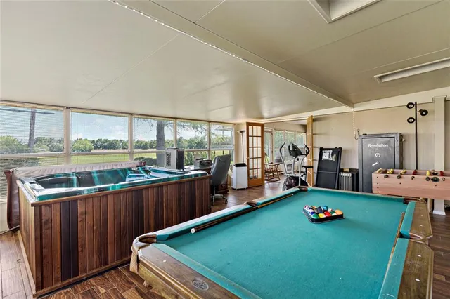 a view of a room with lounge chair and windows
