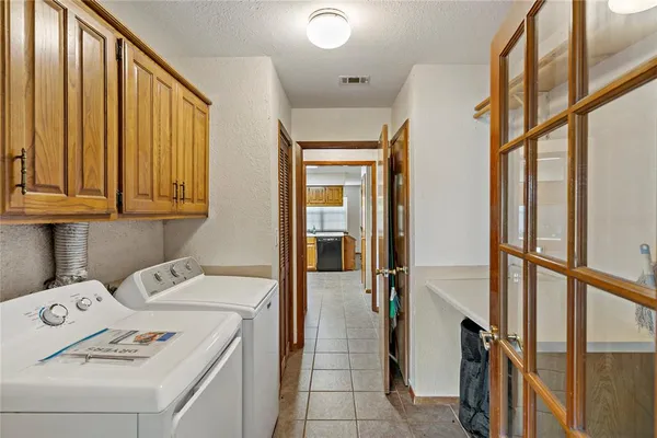 a view of a house with backyard sitting area and garden