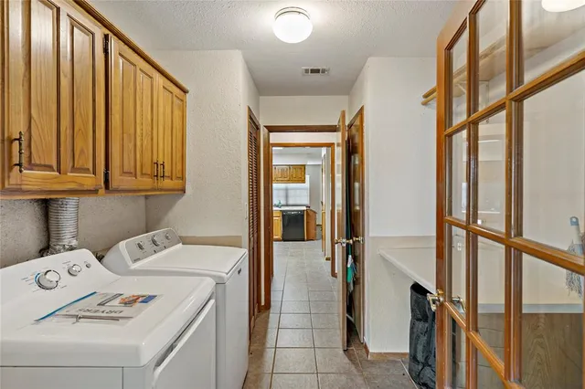 a view of a house with backyard sitting area and garden