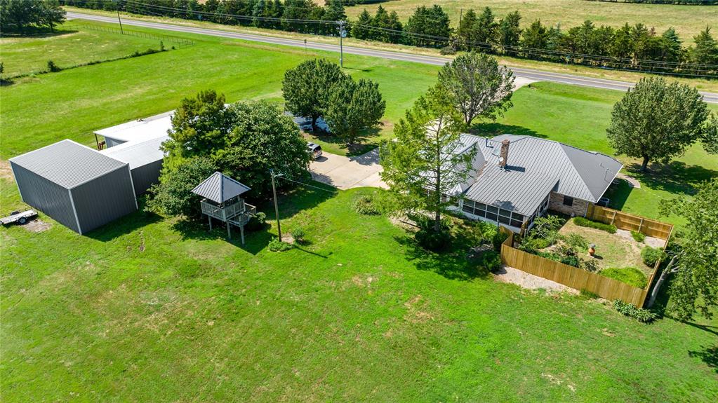 4395 Farm Road 2820 Brookston, TX 75421 - Photo 9 of 33 an aerial view of a house with yard swimming pool and outdoor seating