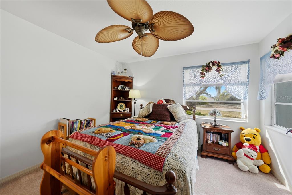 405 Ridgecrest Drive Punta Gorda, FL 33982 - Photo 15 of 30 a bedroom with a bed and dresser