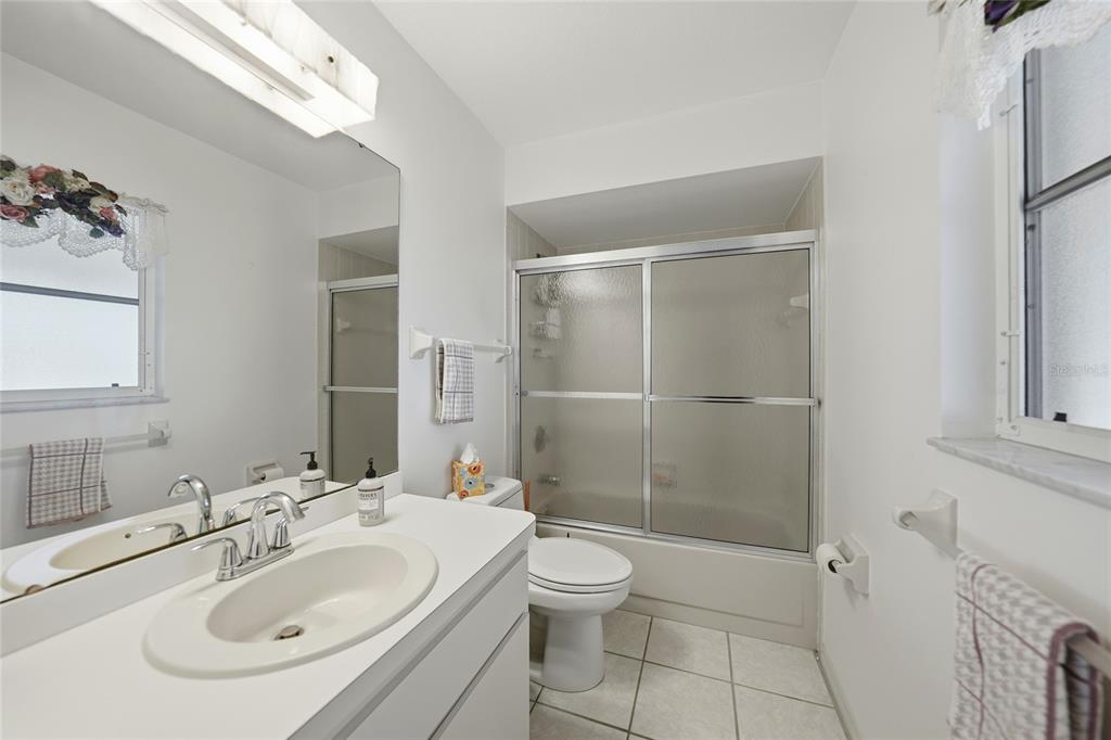 405 Ridgecrest Drive Punta Gorda, FL 33982 - Photo 17 of 30 a bathroom with a sink toilet and shower