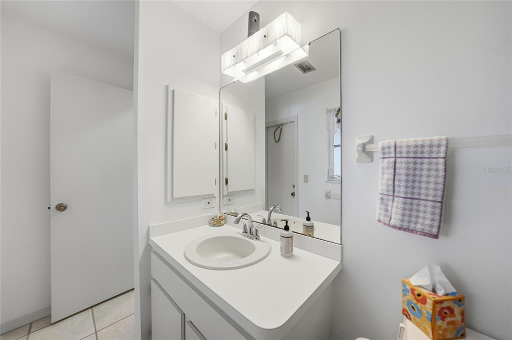 405 Ridgecrest Drive Punta Gorda, FL 33982 - Photo 18 of 30 a bathroom with a sink double vanity and a mirror