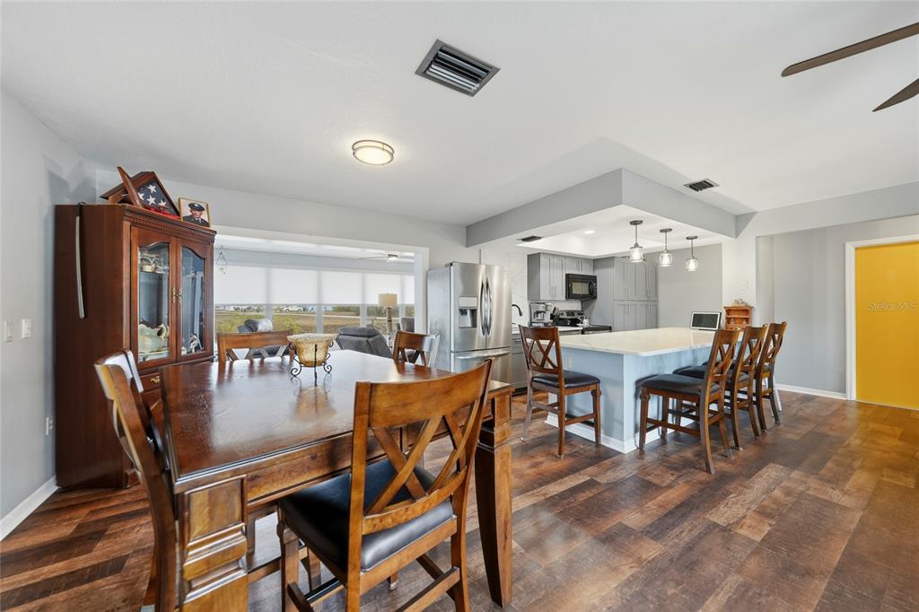 405 Ridgecrest Drive Punta Gorda, FL 33982 - Photo 5 of 30 a dining room with furniture window and wooden floor