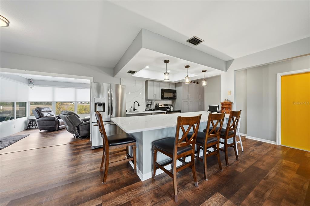 405 Ridgecrest Drive Punta Gorda, FL 33982 - Photo 8 of 30 a view of a dining room with furniture and wooden floor