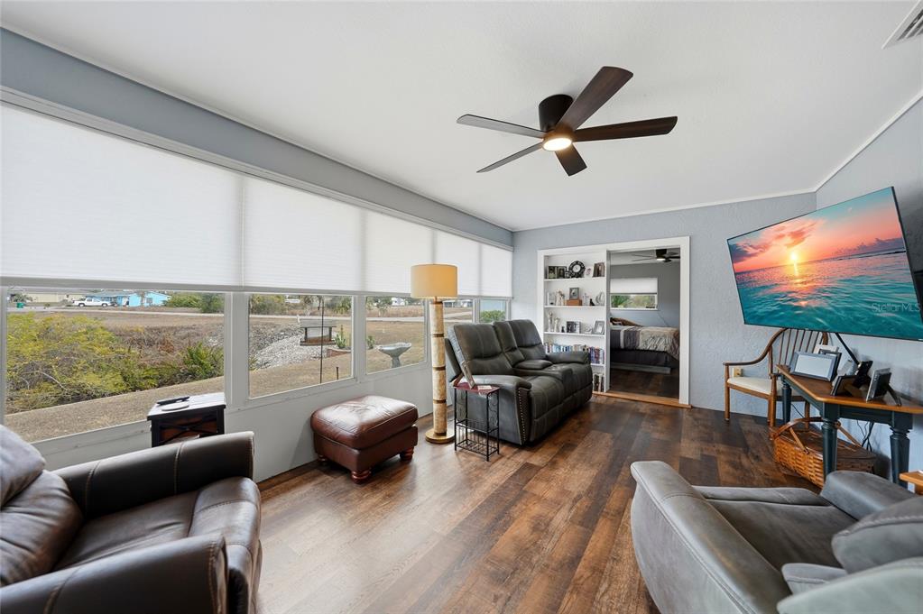 405 Ridgecrest Drive Punta Gorda, FL 33982 - Photo 10 of 30 a living room with furniture ceiling fan and a large window