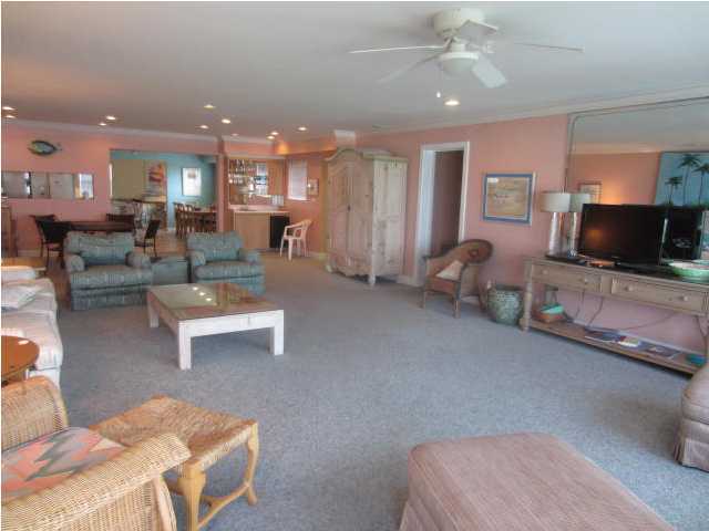 570 Blue Mountain Road Santa Rosa Beach, FL 32459 - Photo 8 of 24 a living room with furniture and a flat screen tv