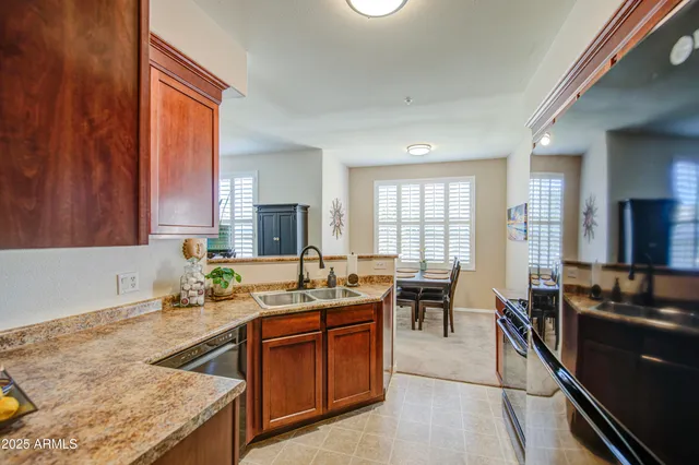 a kitchen with a stove a sink and a refrigerator