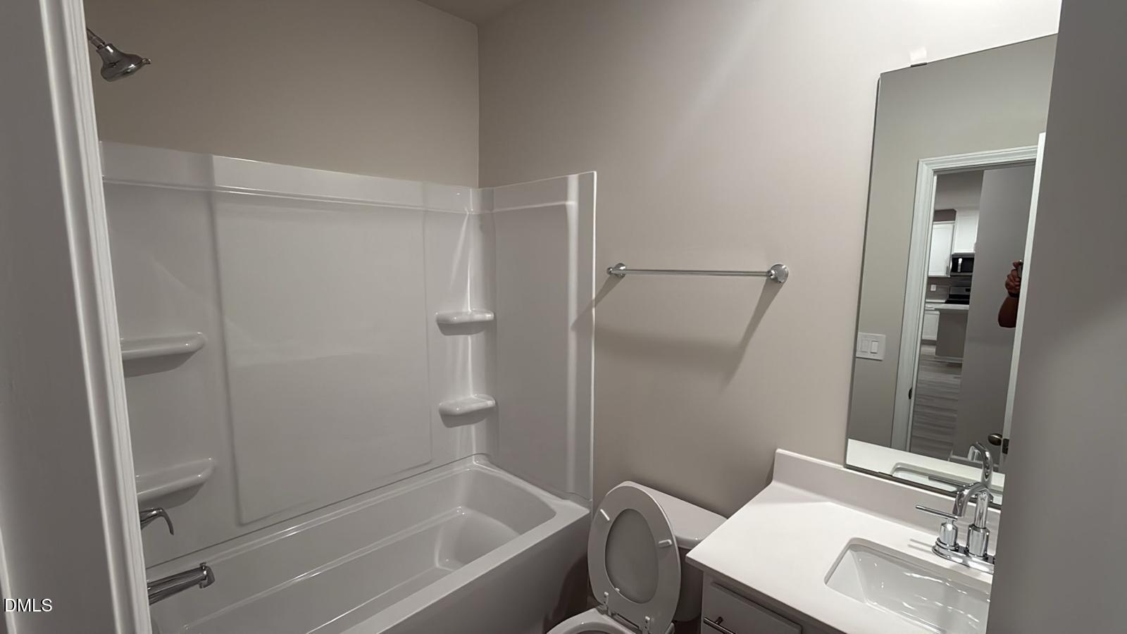 710 White Birch Lane Angier, NC 27501 - Photo 12 of 31 a bathroom with a granite countertop sink toilet and shower