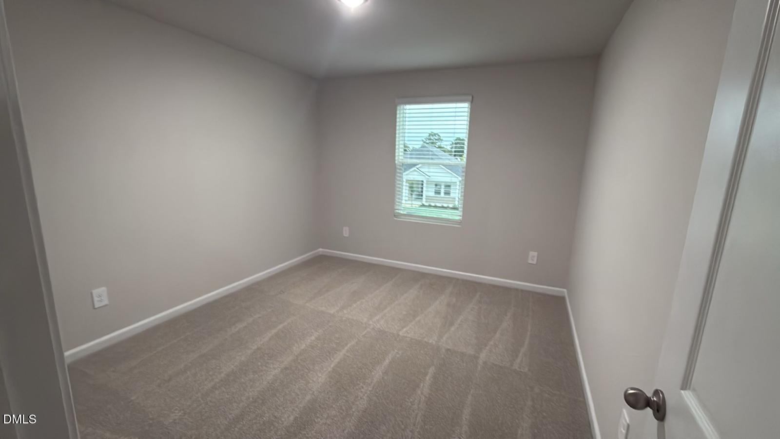 710 White Birch Lane Angier, NC 27501 - Photo 17 of 31 an empty room with a window