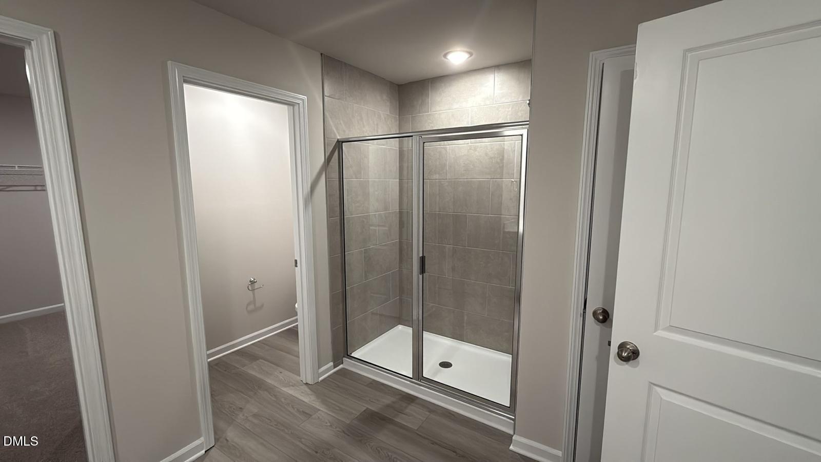 710 White Birch Lane Angier, NC 27501 - Photo 19 of 31 a bathroom with a glass shower door