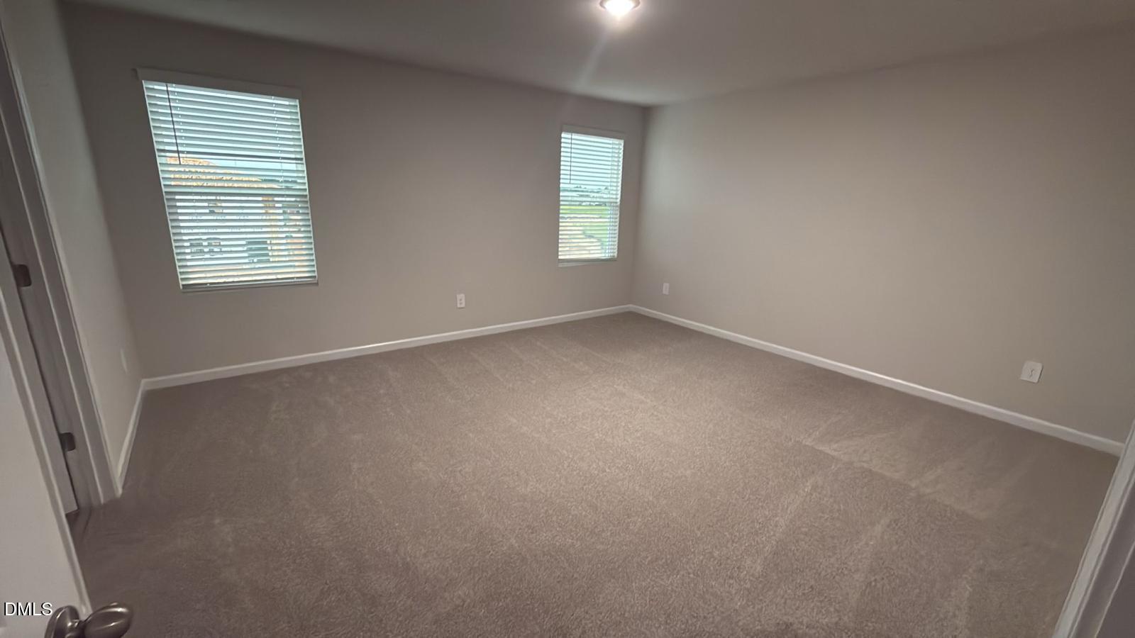 710 White Birch Lane Angier, NC 27501 - Photo 20 of 31 an empty room with windows