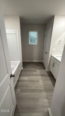 a view of entryway with window and hardwood floor