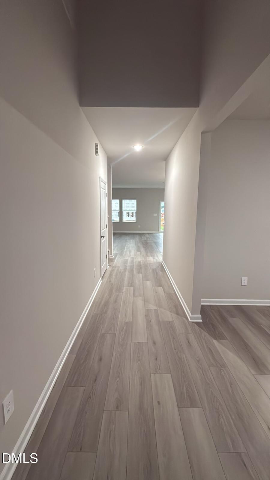 710 White Birch Lane Angier, NC 27501 - Photo 3 of 31 a view of a big room with wooden floor and windows
