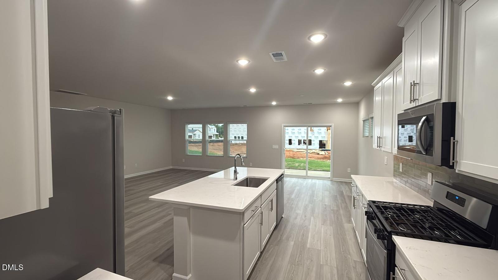710 White Birch Lane Angier, NC 27501 - Photo 6 of 31 a kitchen with sink and refrigerator