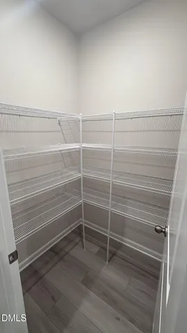 a view of a room with racks on the wall