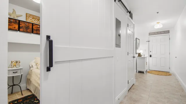 a view of a hallway with wooden shelves
