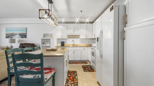 a kitchen with cabinets and window