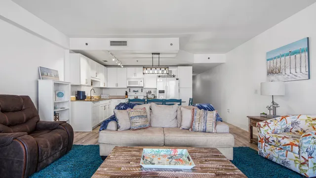 a living room with furniture and a rug