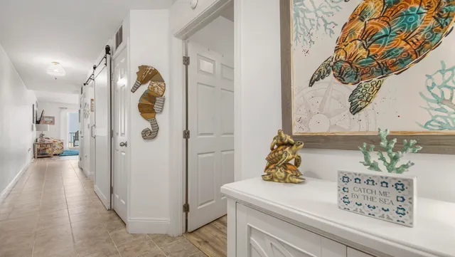 a view of hallway and chandelier