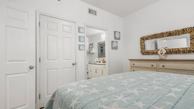 a bedroom with a bed and a dresser