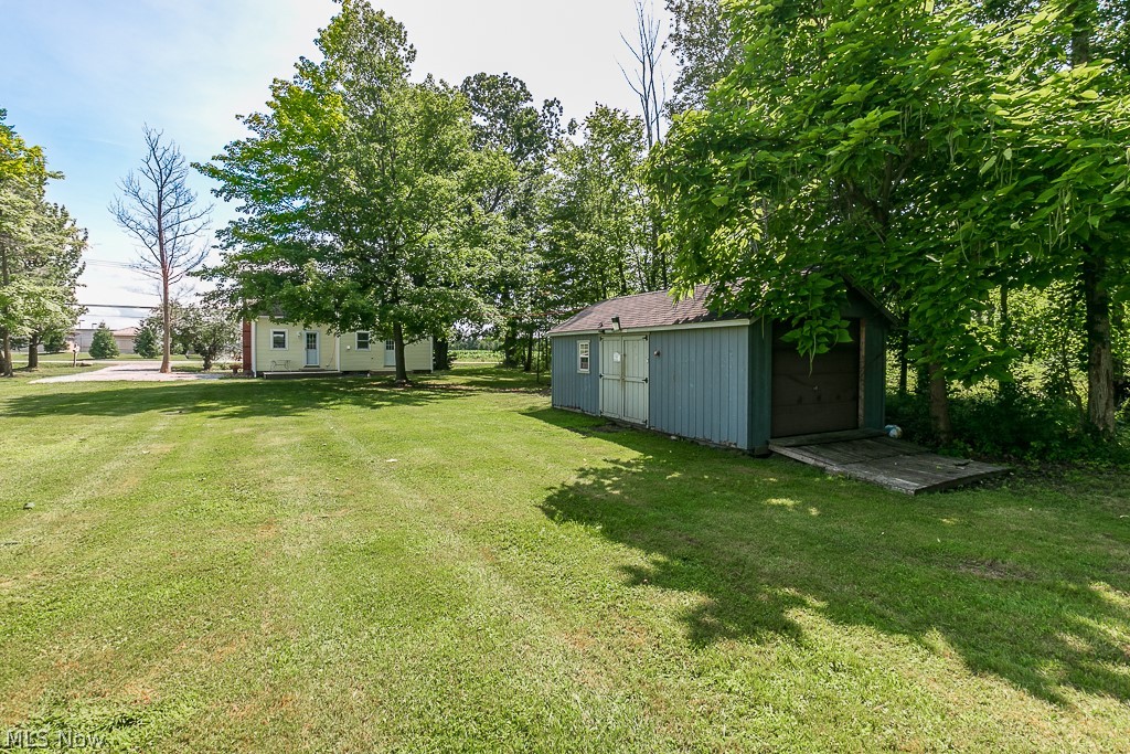 16506 Leroy Thompson Road Thompson, OH 44086 - Photo 14 of 41 View of yard featuring an outbuilding