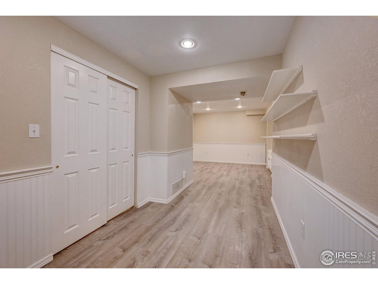 1265 Bear Mountain Drive, Unit B Boulder, CO 80305 - Photo 12 of 24 a view of an empty room and wooden floor
