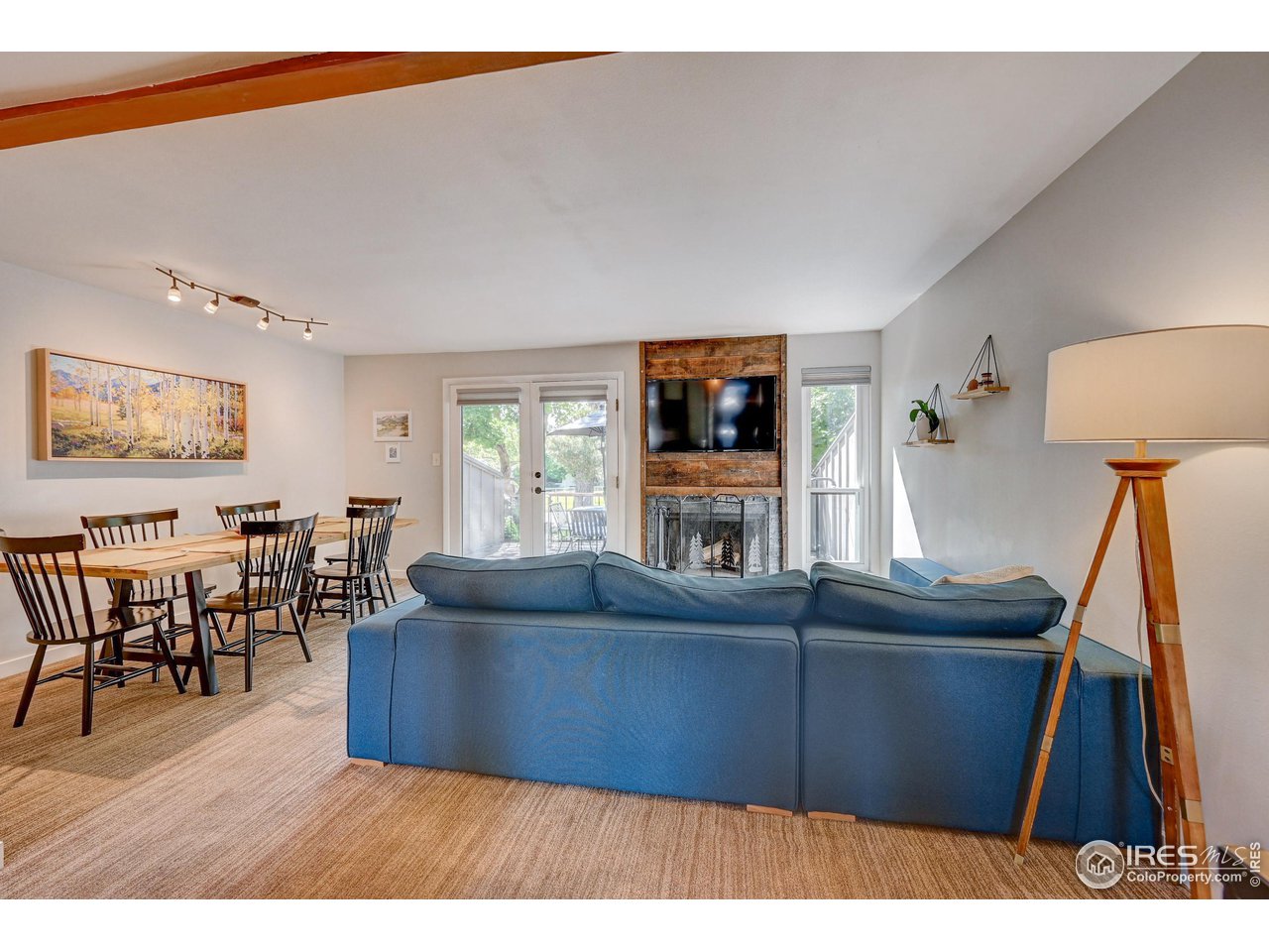1265 Bear Mountain Drive, Unit B Boulder, CO 80305 - Photo 14 of 24 a living room with furniture and a flat screen tv