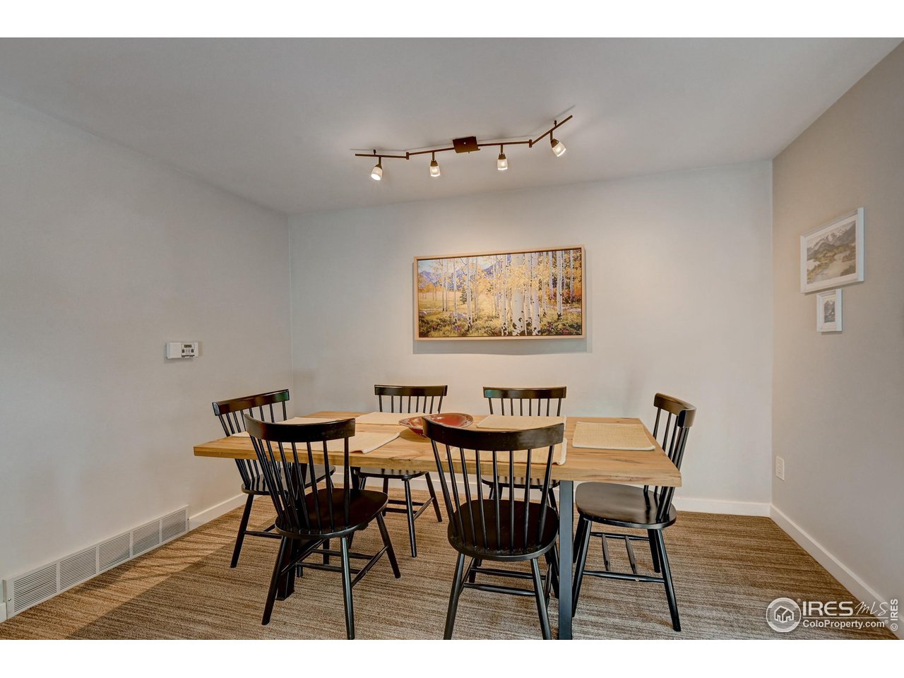 1265 Bear Mountain Drive, Unit B Boulder, CO 80305 - Photo 15 of 24 a view of a dining room with furniture and wooden floor