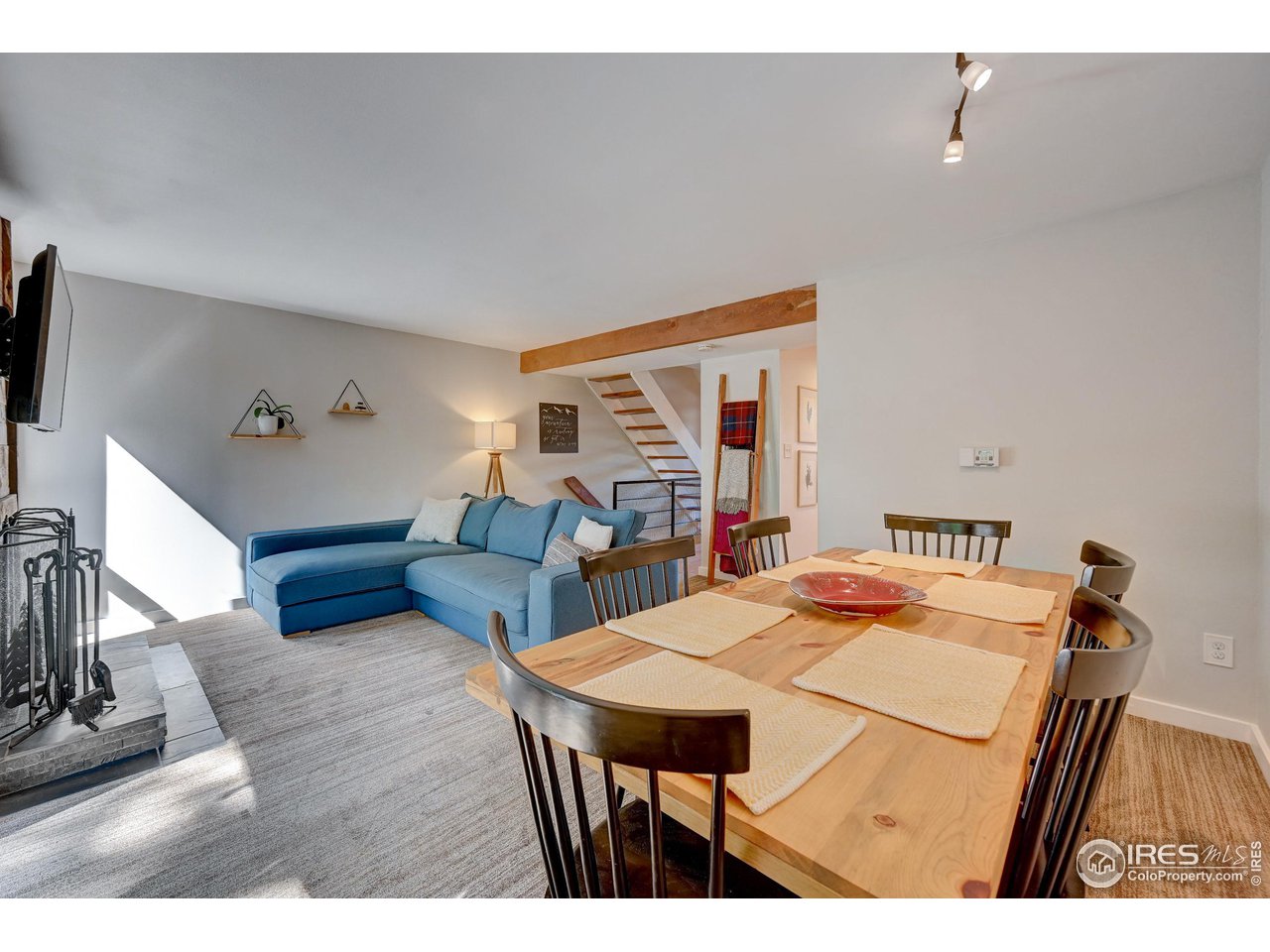1265 Bear Mountain Drive, Unit B Boulder, CO 80305 - Photo 24 of 24 a living room with furniture a flat screen tv and a table