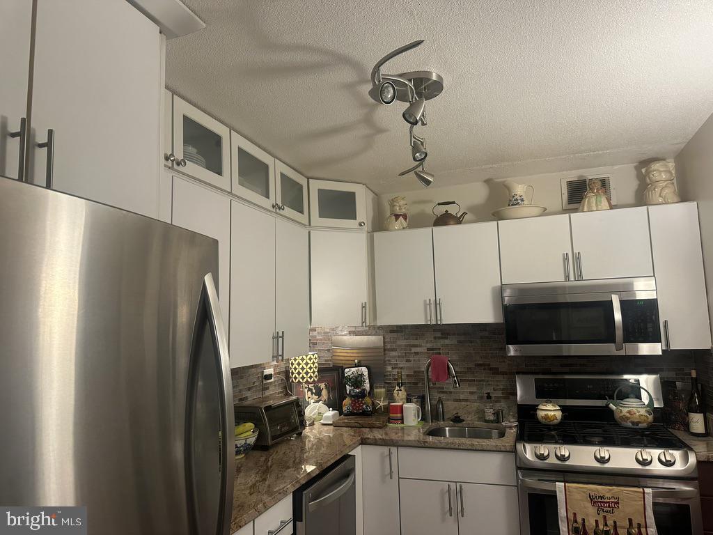 700 7th Street Southwest, Unit 526 Washington, DC 20024 - Photo 12 of 53 Modern kitchen with sleek finishes.