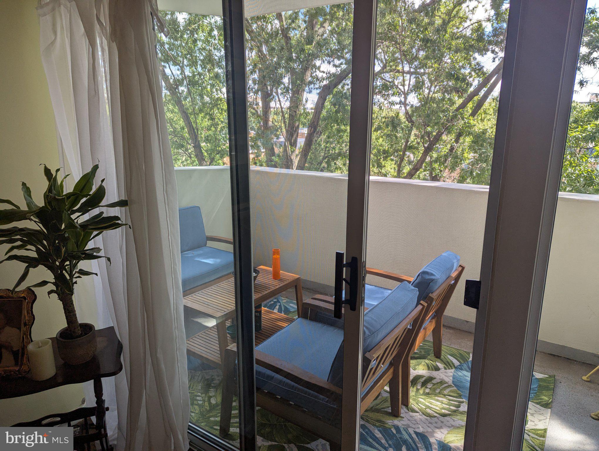 700 7th Street Southwest, Unit 526 Washington, DC 20024 - Photo 16 of 53 Serene balcony retreat in nature.