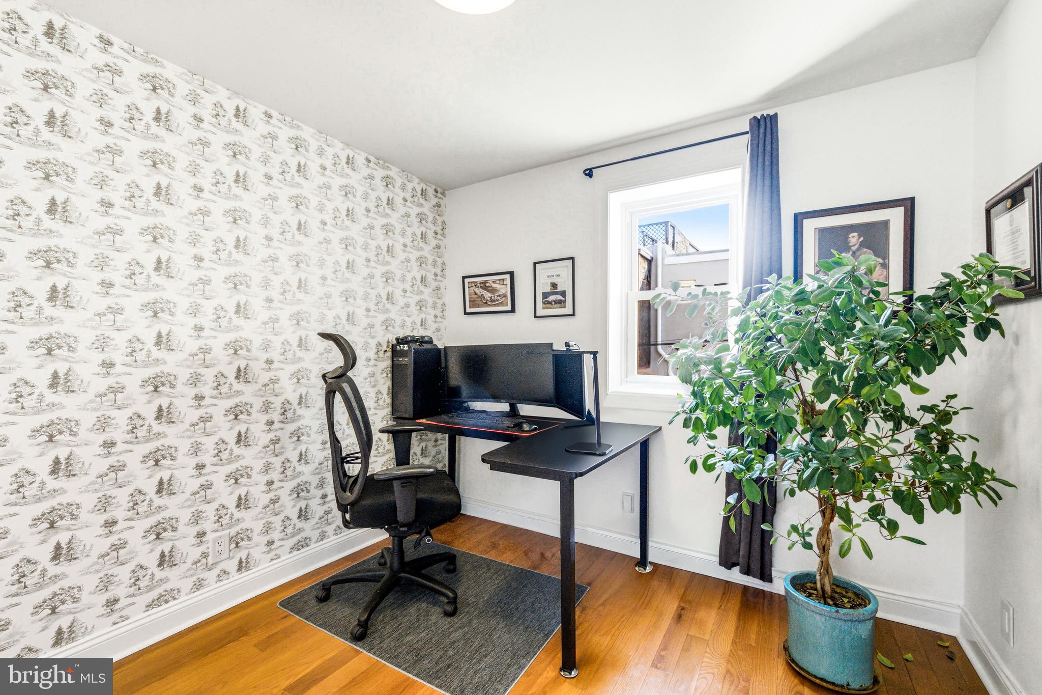 523 South 27th Street Philadelphia, PA 19146 - Photo 12 of 34 a workspace with furniture and wooden floor