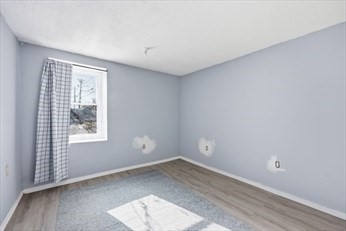 875 North Main Street, Unit 1 Randolph, MA 02368 - Photo 11 of 15 an empty room with a window
