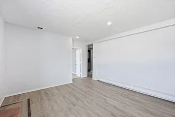 a view of livingroom with hardwood floor and a window