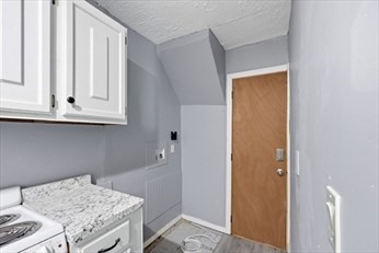 875 North Main Street, Unit 1 Randolph, MA 02368 - Photo 4 of 15 a storage room with washer and dryer