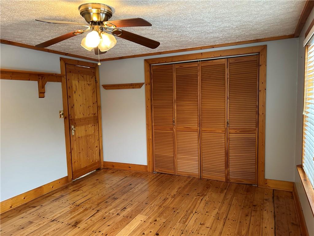1675 Raspberry Road Clymer, PA 15728 - Photo 12 of 43 an empty room with wooden floor closet and windows