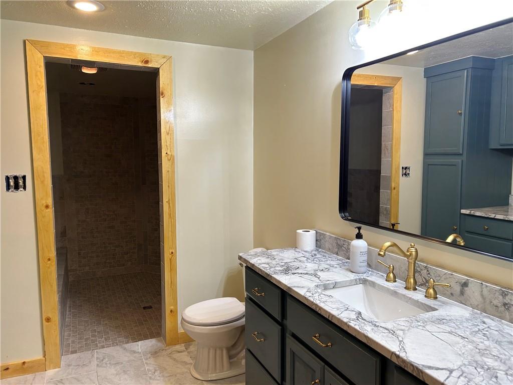 1675 Raspberry Road Clymer, PA 15728 - Photo 17 of 43 a bathroom with a granite countertop sink toilet and mirror