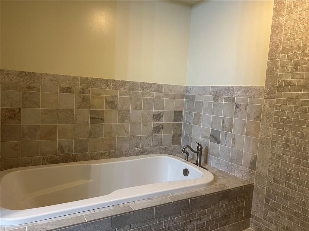 1675 Raspberry Road Clymer, PA 15728 - Photo 19 of 43 a bathroom with a bathtub and shower
