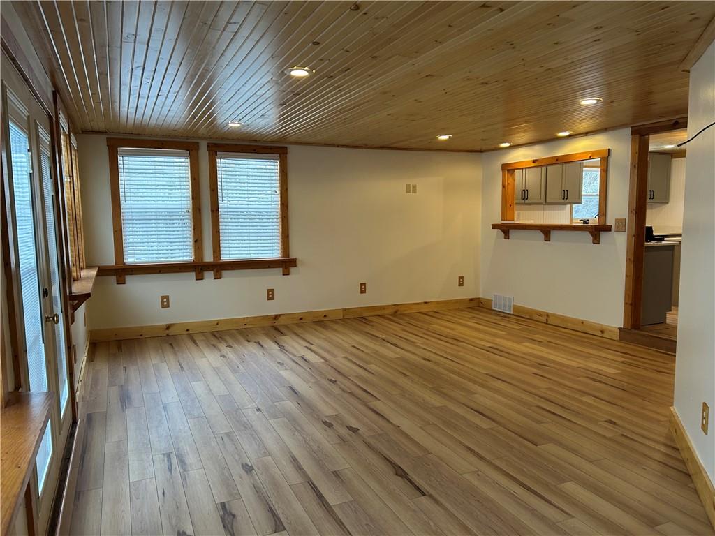 1675 Raspberry Road Clymer, PA 15728 - Photo 22 of 43 an empty room with wooden floor and windows