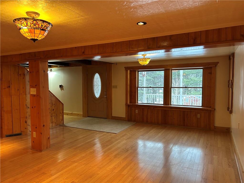 1675 Raspberry Road Clymer, PA 15728 - Photo 30 of 43 a view of an empty room with window wooden floor and door