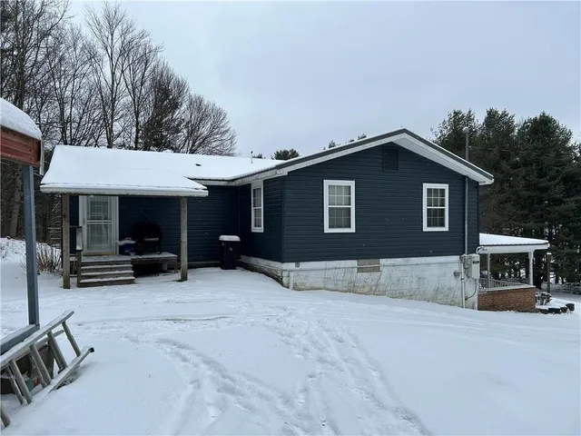 a house with trees in the background