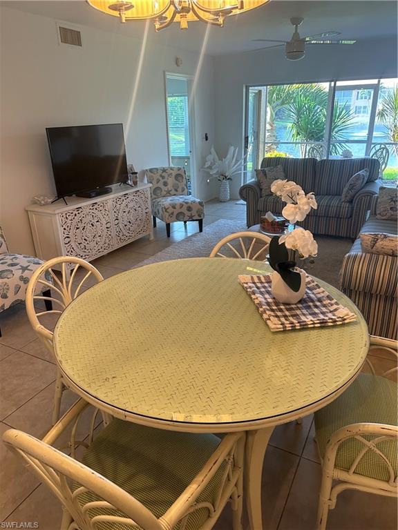 1950 West Crown Pointe Boulevard, Unit B106 Naples, FL 34112 - Photo 19 of 33 a living room with furniture and a flat screen tv