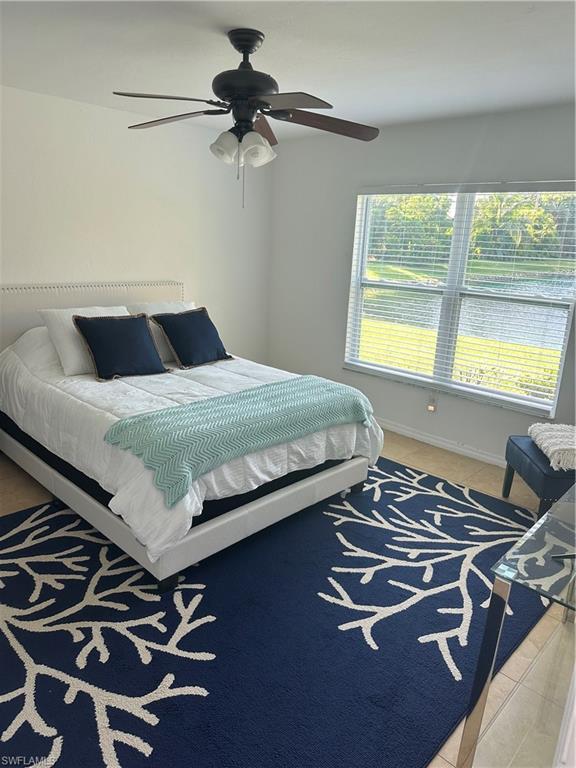 1950 West Crown Pointe Boulevard, Unit B106 Naples, FL 34112 - Photo 20 of 33 a bedroom with a bed and a window