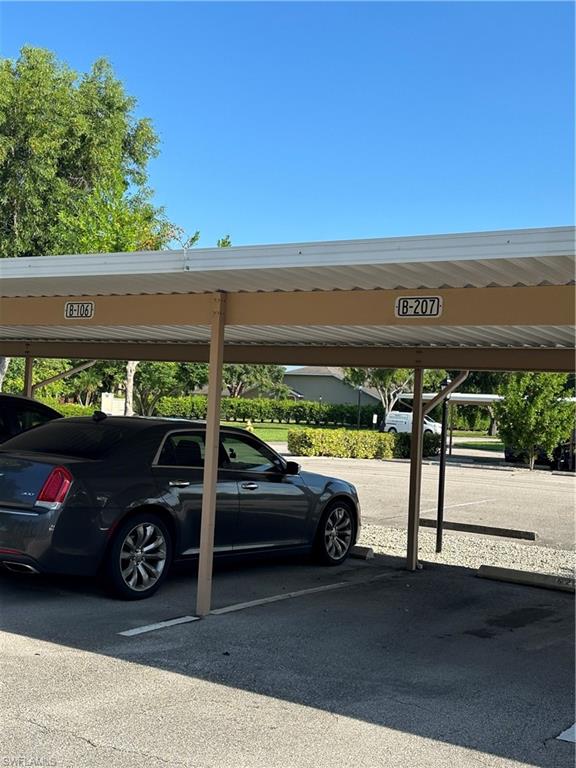 1950 West Crown Pointe Boulevard, Unit B106 Naples, FL 34112 - Photo 2 of 33 a view of outdoor space with seating area